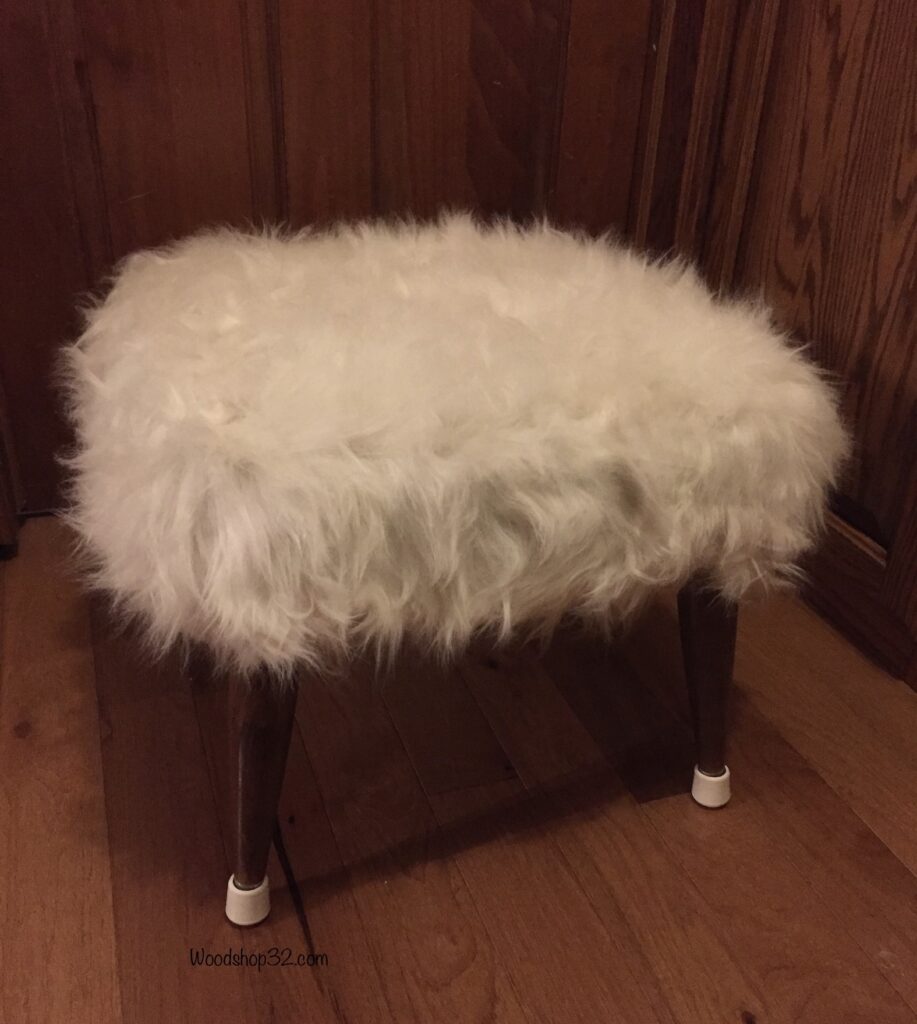 repurposed mid-century modern footstool ottoman with faux fur