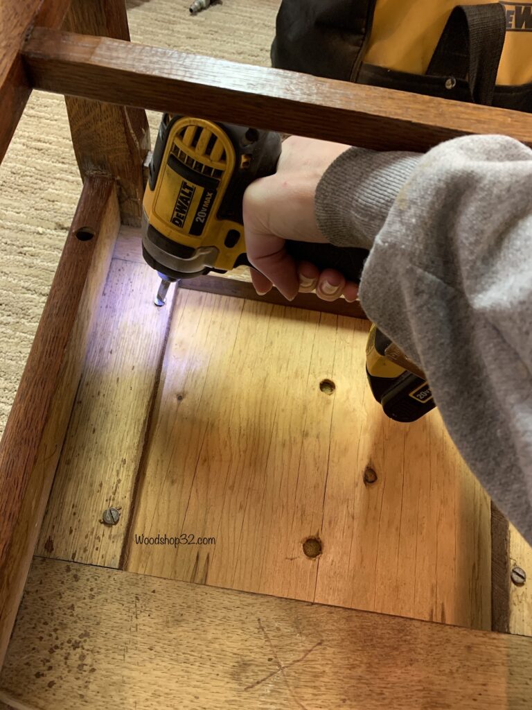 removing chair seat with cordless screwdriver