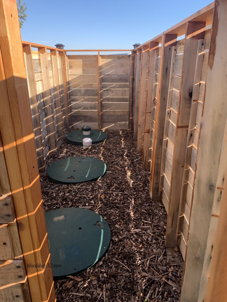 inside view of pallet fence around septic covers