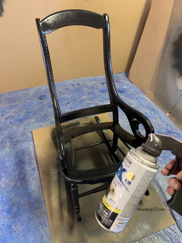 spray painting rocking chair frame with satin black