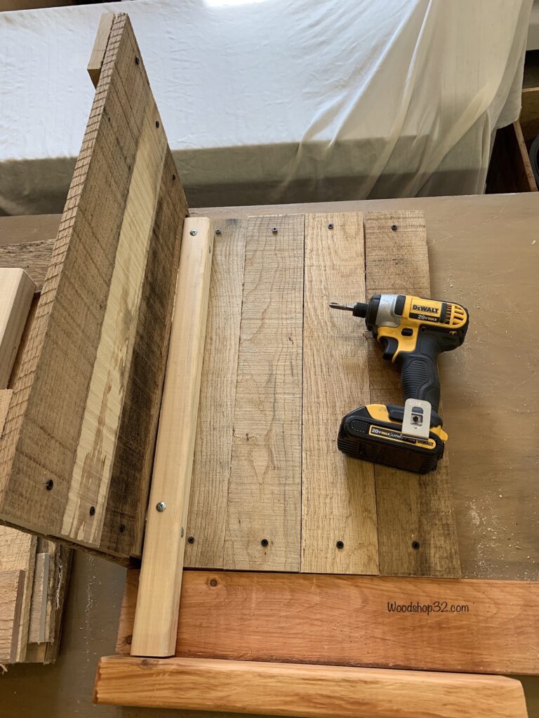 attaching pallet wood sides to leg using jig for height