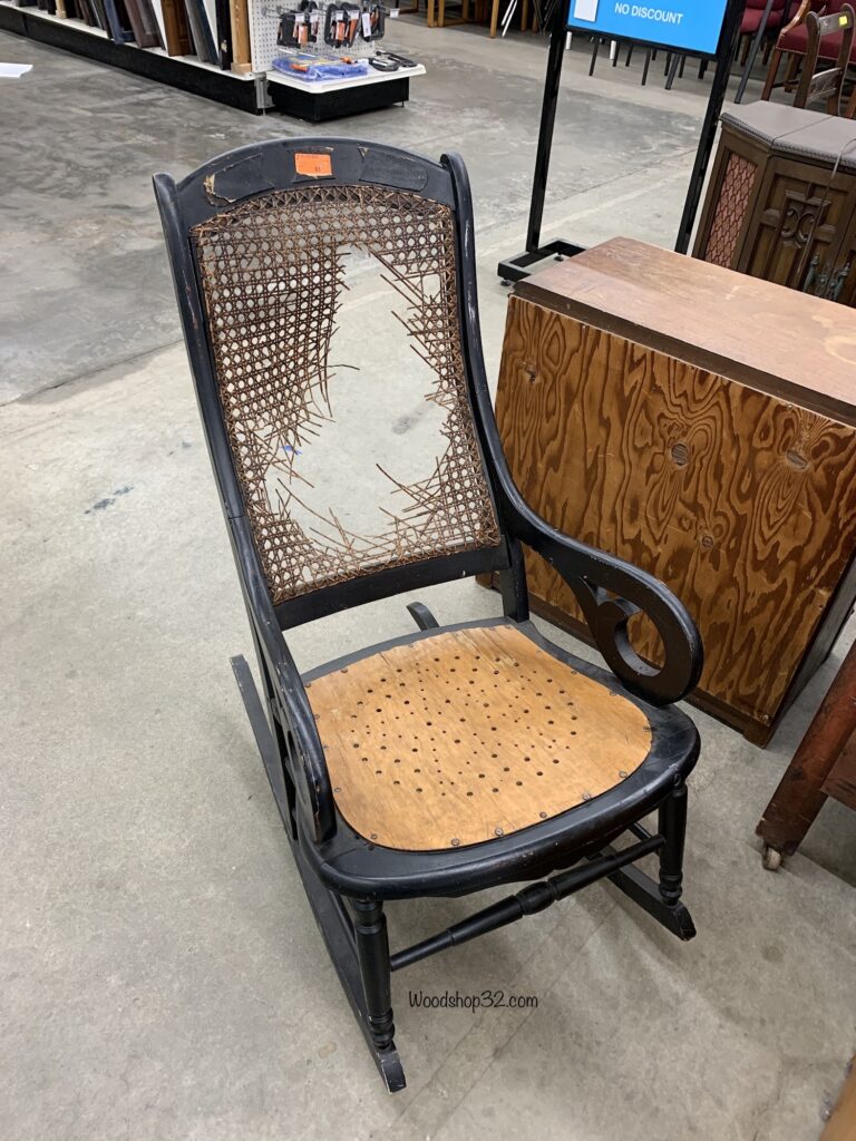 store photo of old vintage rocking chair with broken back support