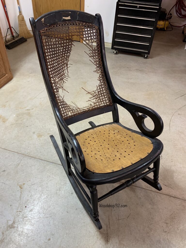 old vintage rocking chair with broken back support