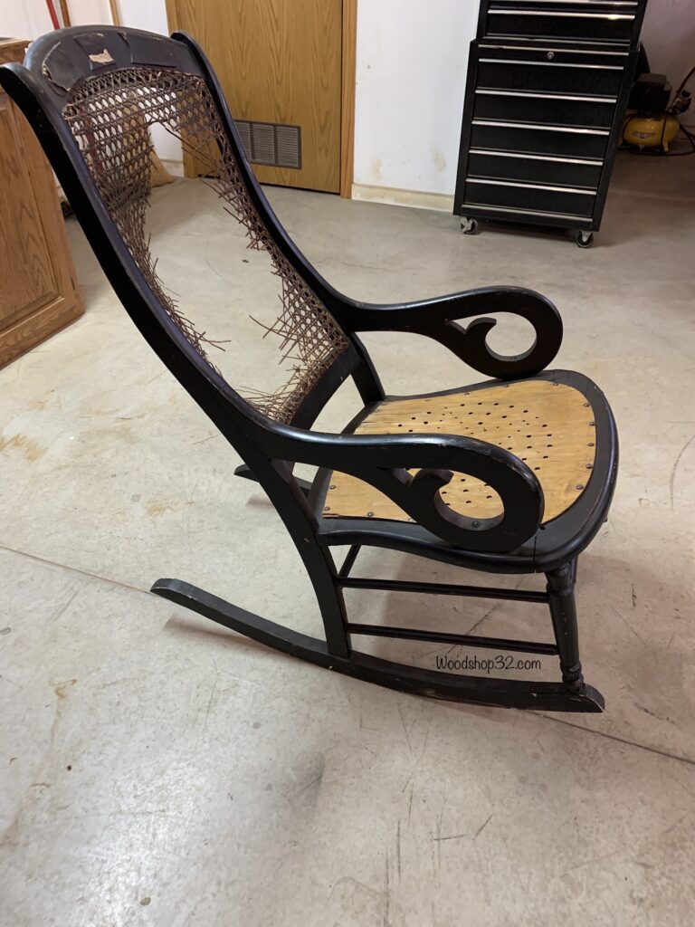 side view of old vintage rocking chair with broken back support