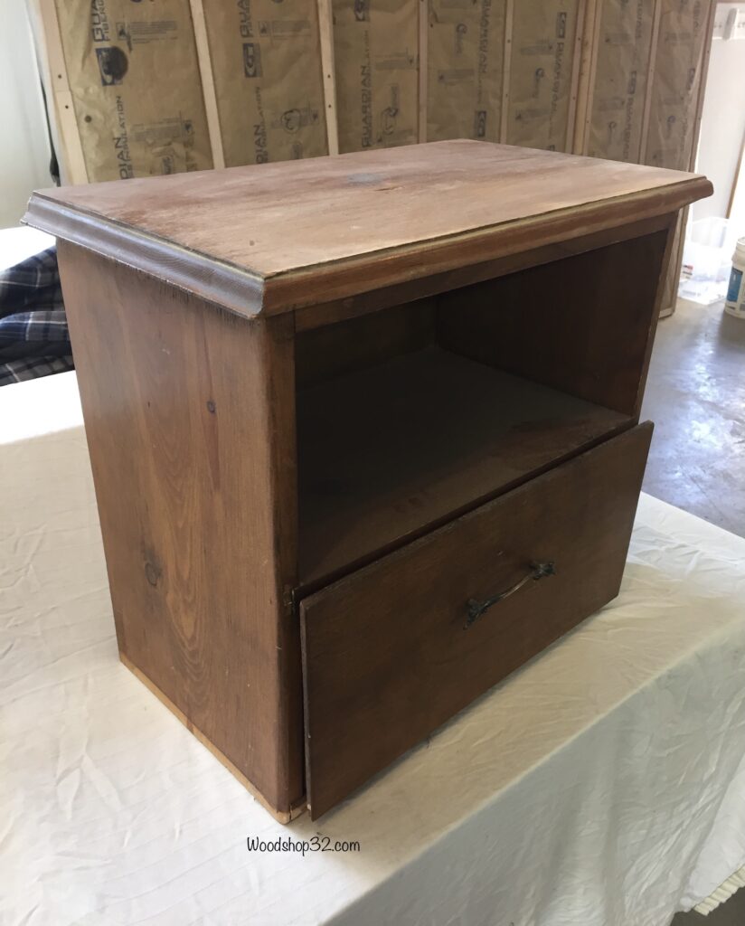 tiny brown open shelf cabinet with no legs