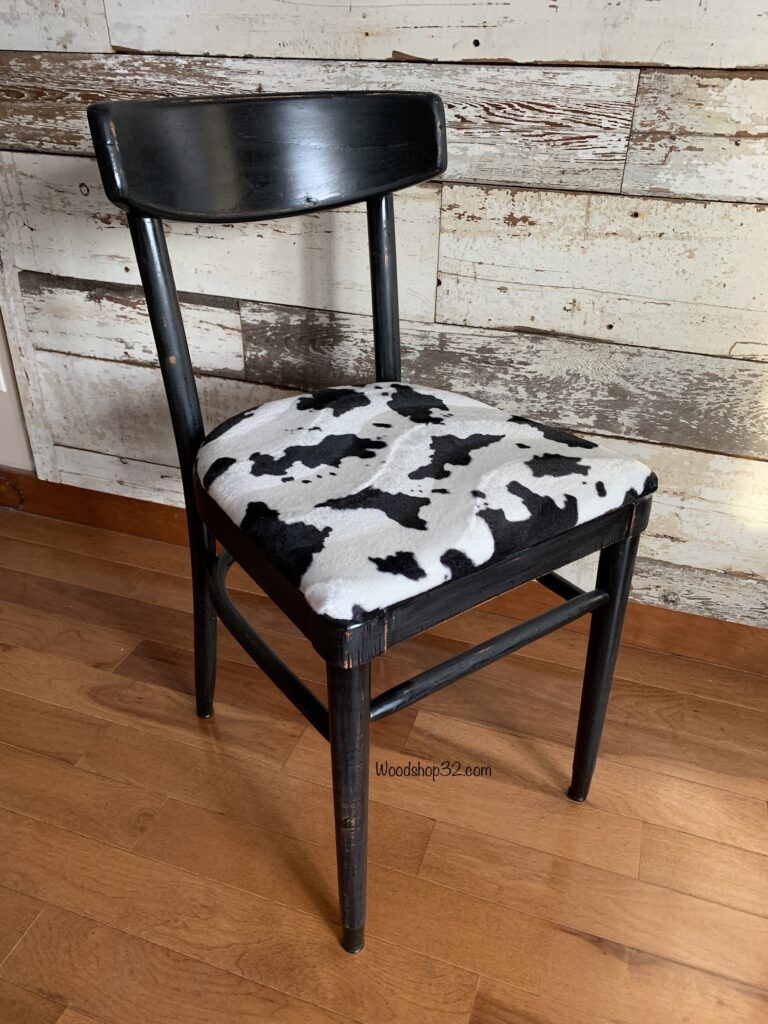 repurposed mid century modern chair with faux cow print