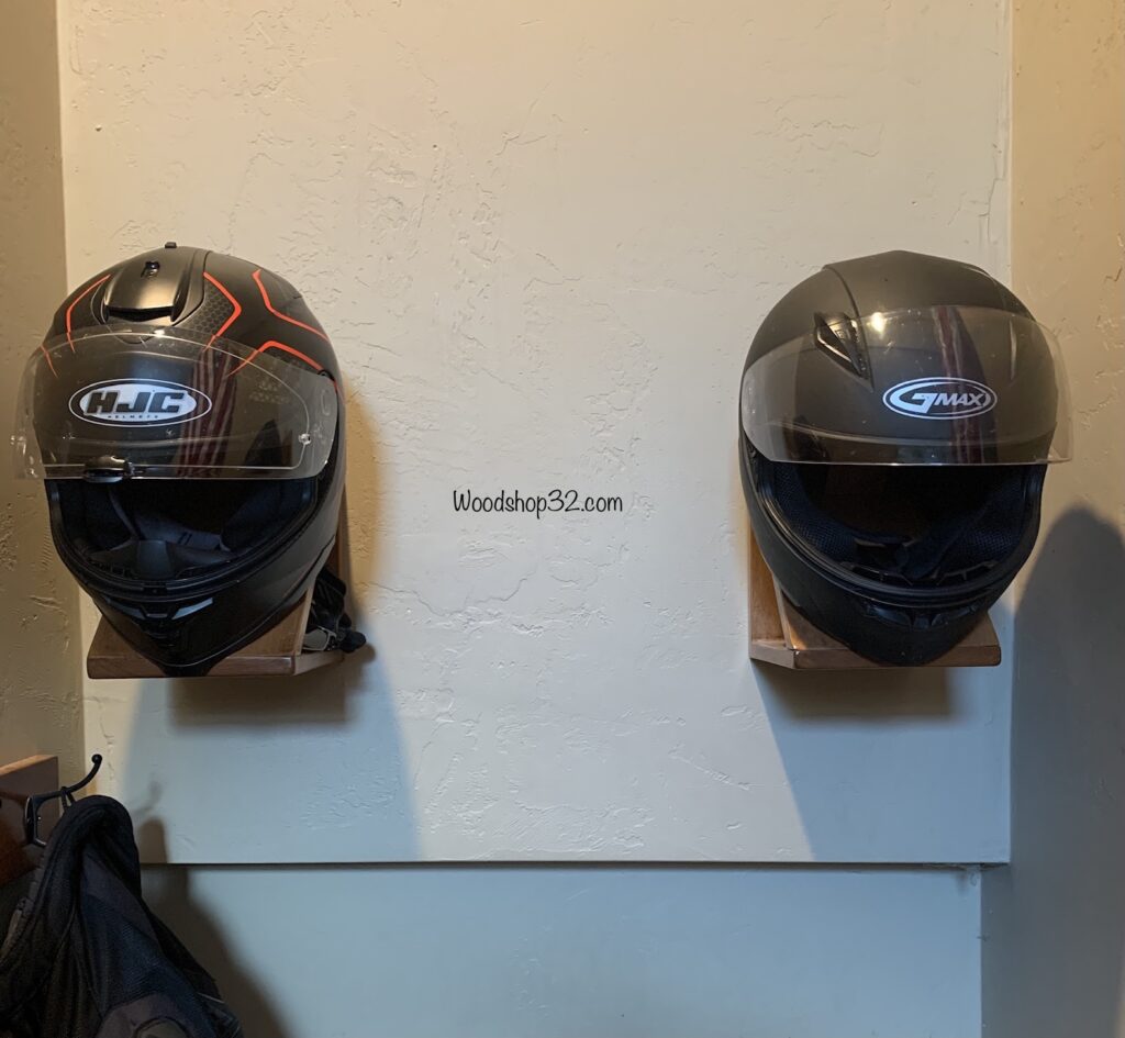 motorcycle helmet holders attached to wall