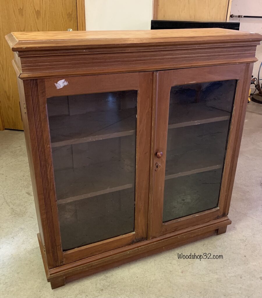 vintage display cabinet with glass doors